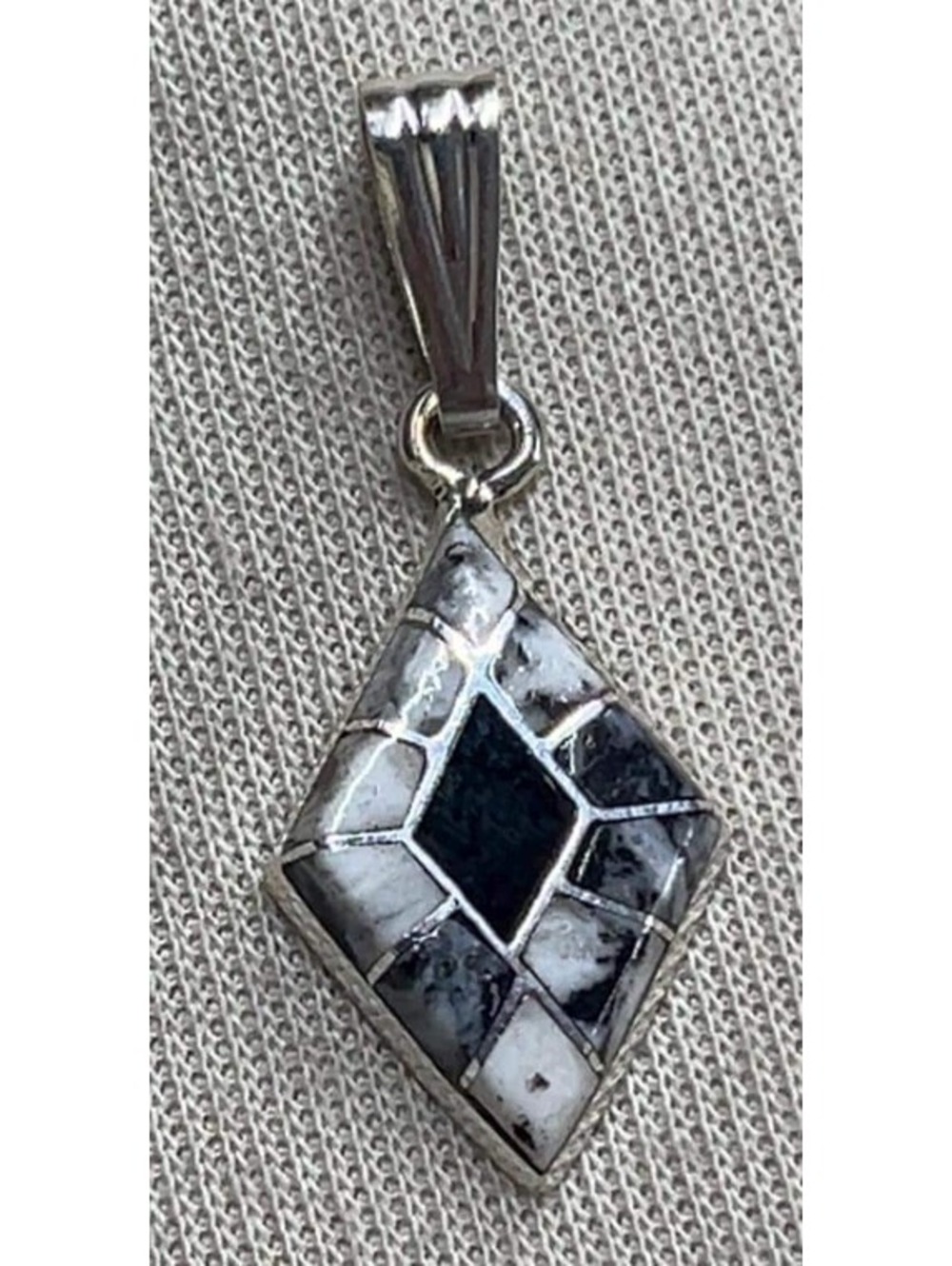 Native American Zuni handmade sterling silver white buffalo inlay pendant/charm